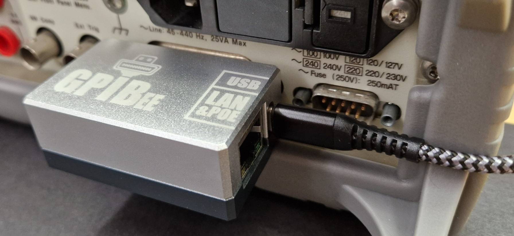 GPIBee connected to the GPIB port on the back of a benchtop instrument with a USB cable