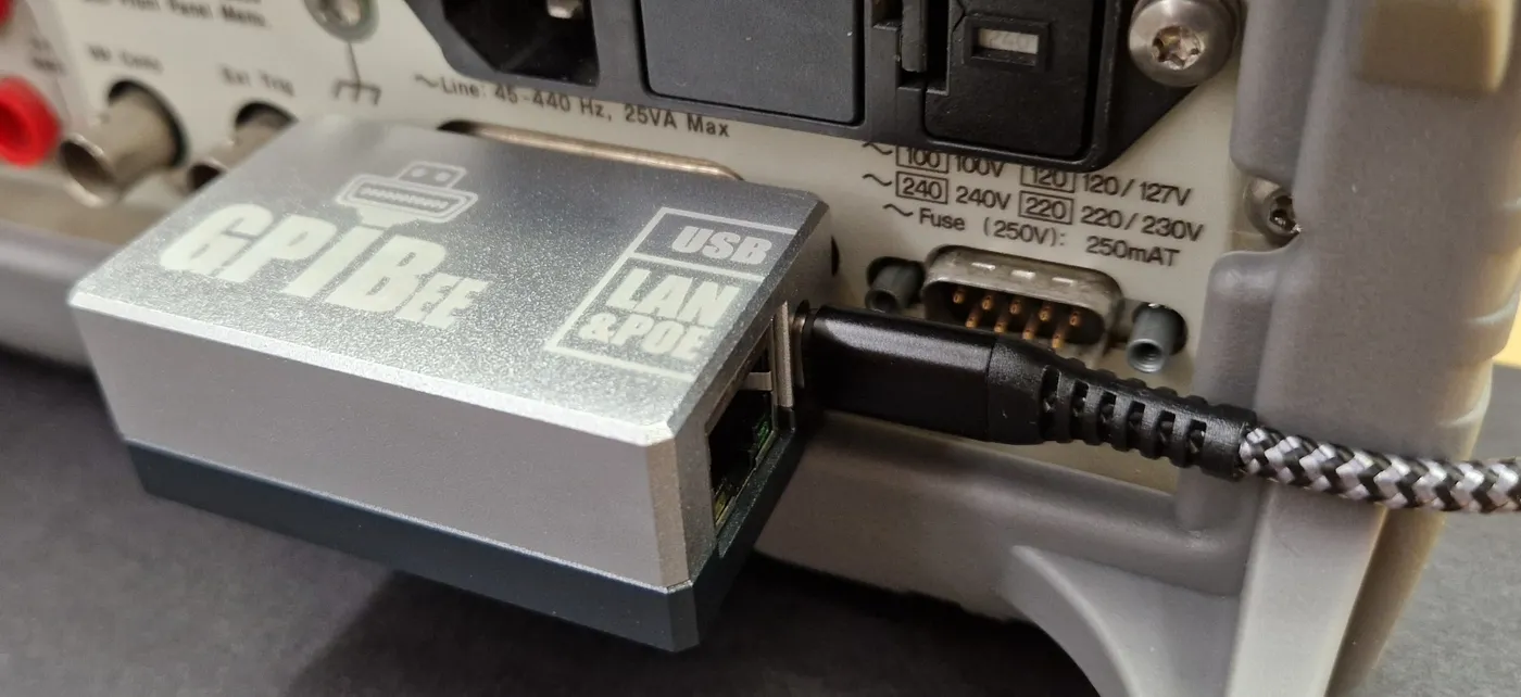GPIBee connected to the GPIB port on the back of a benchtop instrument with a USB cable